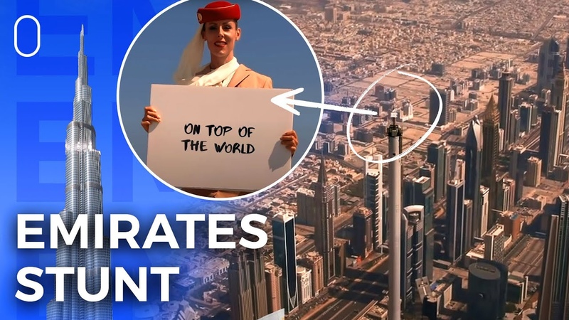 Emirates Flight Attendant Stands On Top Of The Burj